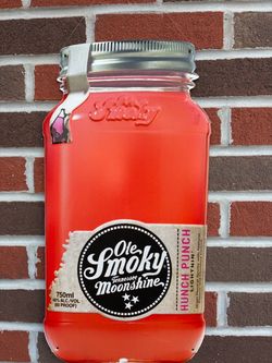 metal advertising sign shaped like a mason jar for Ole Smoky Hunch Punch Lightnin' Moonshine.