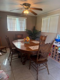 Wooden table w/ 4 chairs, and ceiling fan