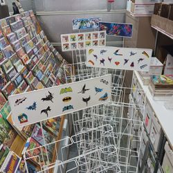 Comic book/magazine easel style wire racks 20 pocket. $40 each. Spider-Man, Batman, Superman themed.