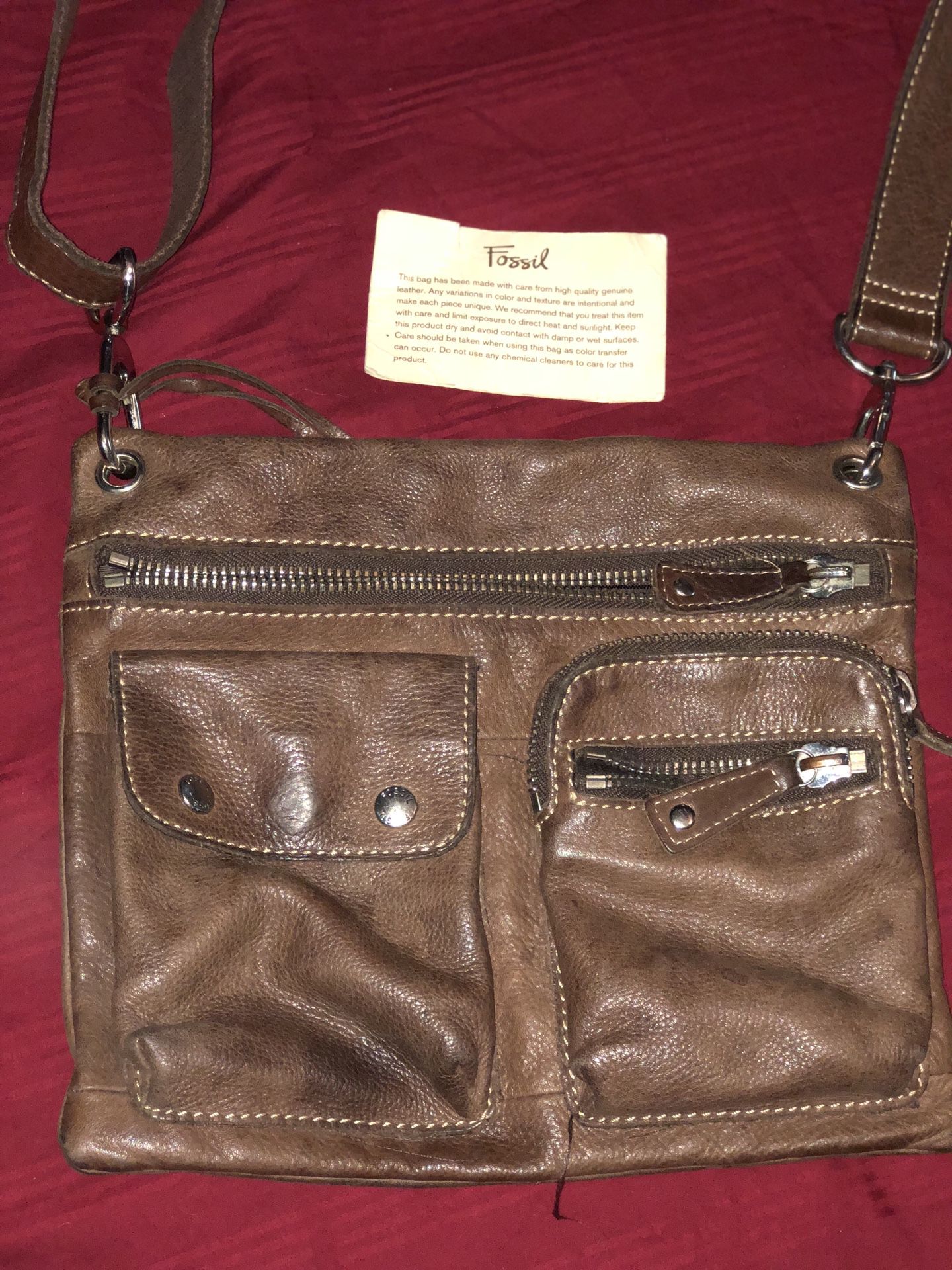 FOSSIL MESSENGER BAG. Same as the one in Hangover. Brown leather