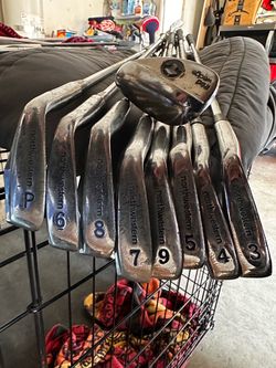 Left handed NorthWestern golf irons set and 3 matching clubs with a hippo Putter