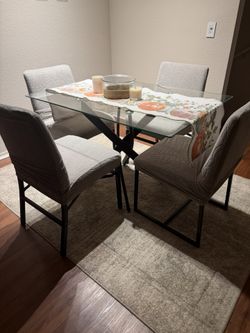 Glass table and four chairs