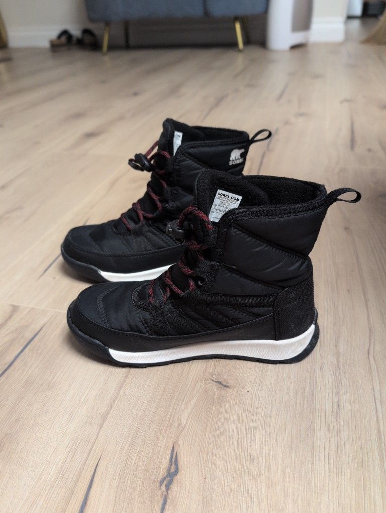 Sorel Children's Whitney II Short Lace waterproof winter boots in black with red accents.