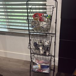 3 Tiered standing storage Rack with baskets . See pictures. Things not included .