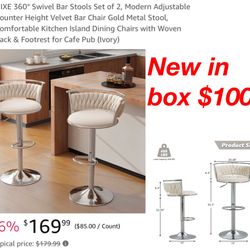 New In Box ivory with silver base Set Of 2 Adjustable Bar Stools. $100 Cash Only East Palmdale