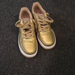 Gold Nikes 