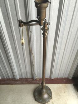 Vintage brass swing arm lamp with wheat decor at base very nice