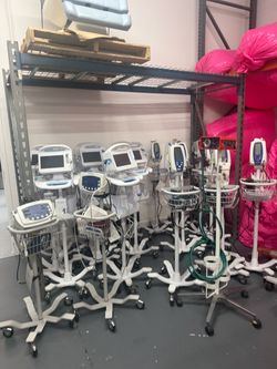 Lot of Medical Patient Vital Signs Monitors on Stands