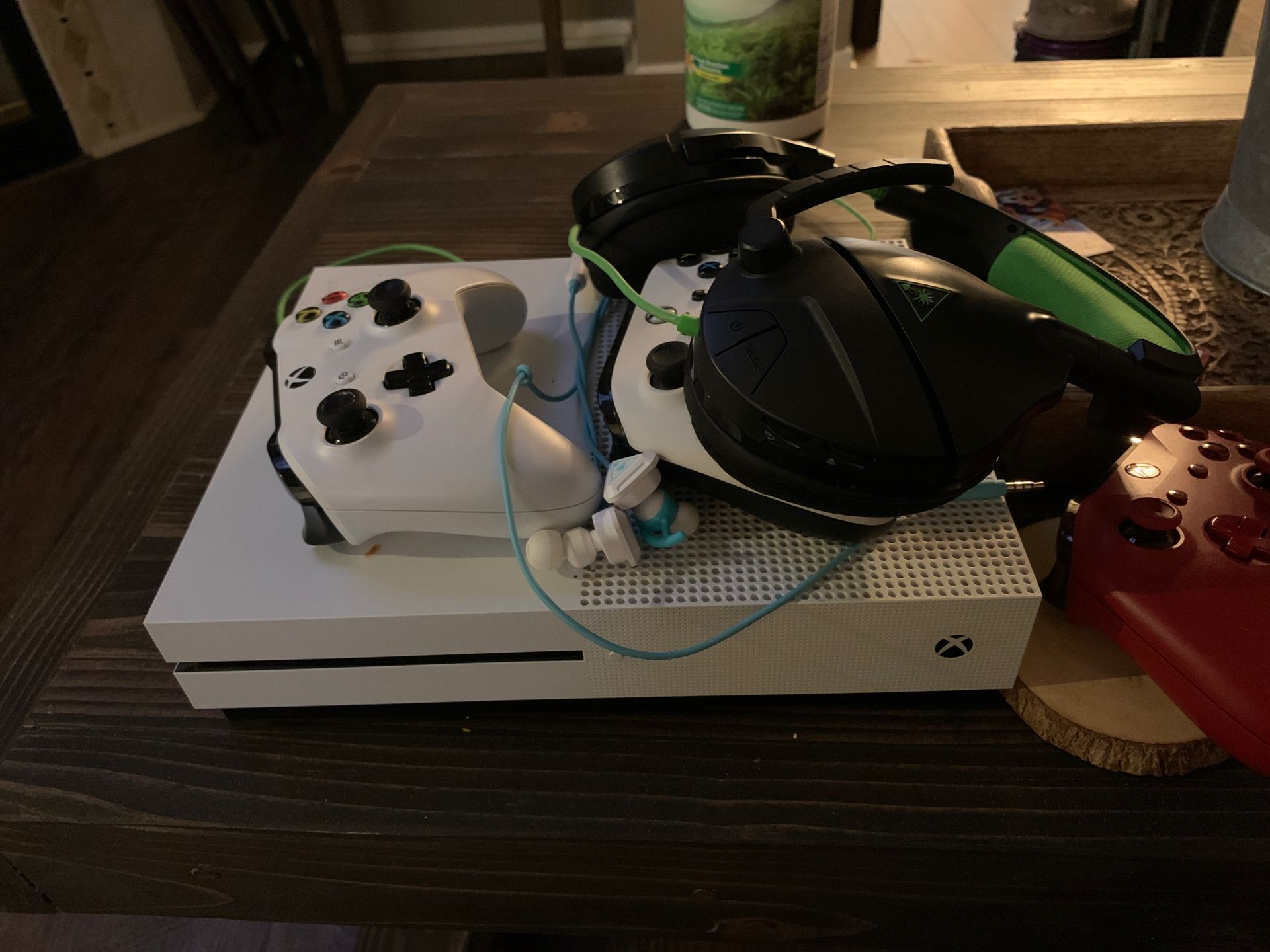 Xbox one S plus 2 wireless controllers, one wired controller ,turtle beach over the ear headset, turtle beach earbud headset. Xbox also have digital