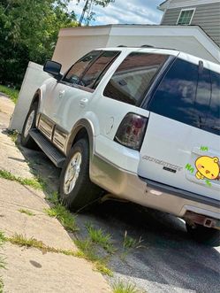 03 ford with branding new 20” rims in box