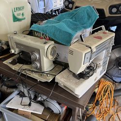 2 vintage Sewing Machines, Unknown Condition One Comes With A Wooden Cabinet Drawers With Miscellaneous Parts