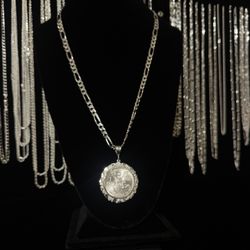Original silver centenario with Figaro chain