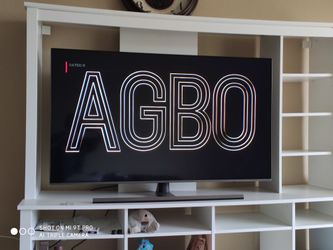 55 inch Samsung (nu8000) Tv with cabinet