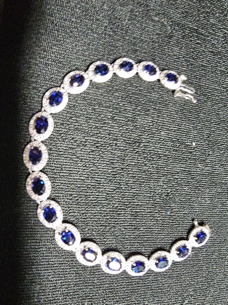 White gold and blue sapphire And diamond Tennis bracelet.