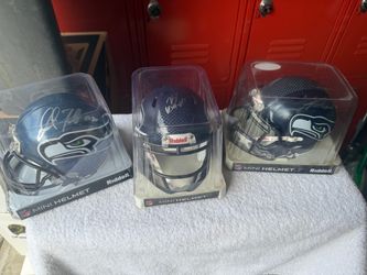 Cam Chancellor, KJ Wright and Marcus Trufont autographed Seattle Seahawk mini helmets Cam Chancellor, KJ Wright and Marcus Trufont autographed Seattle
