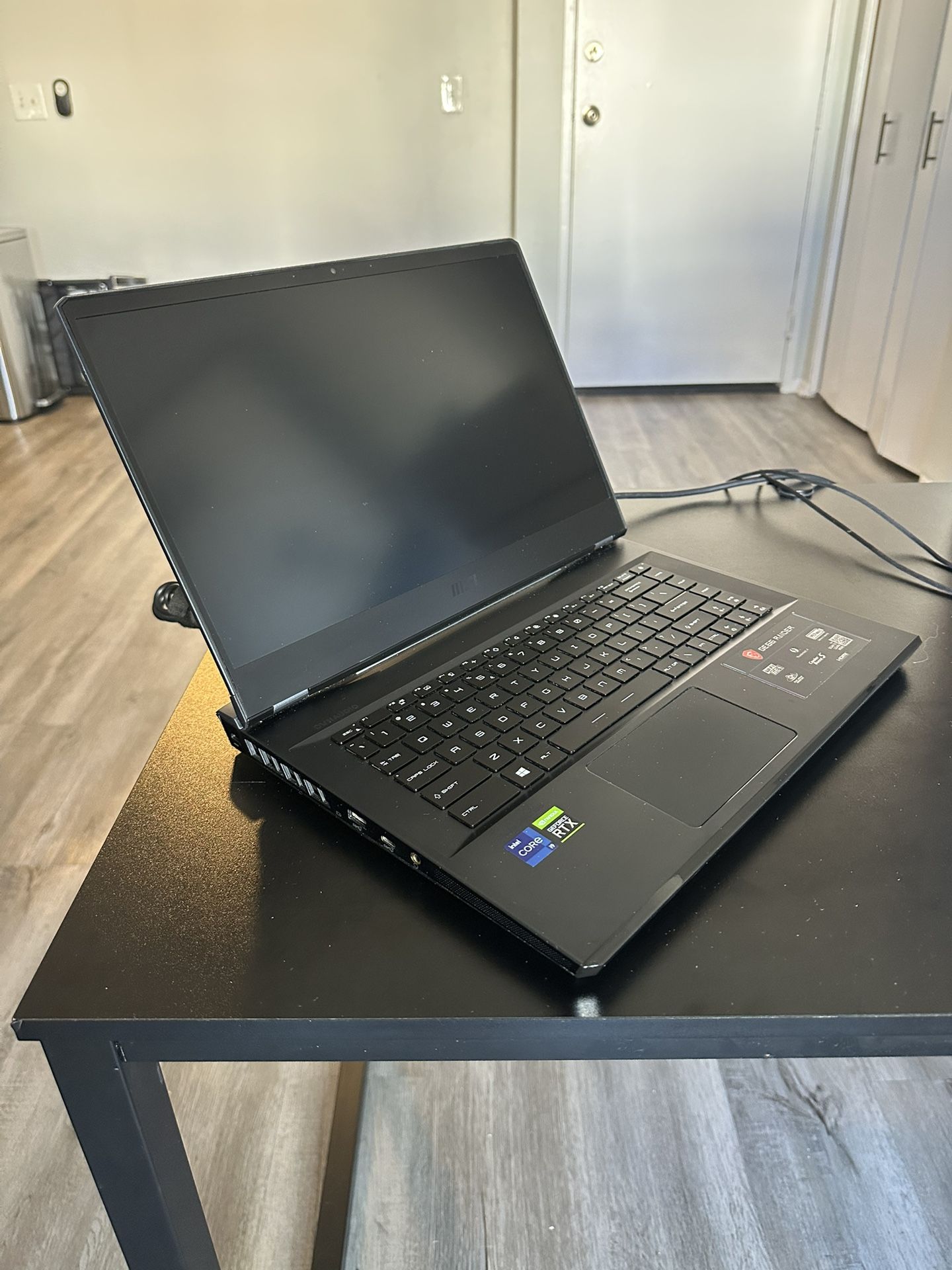 MSI GE Series GE66 RAIDER Gaming laptop and power supply