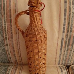 Greek wine bottle with wicker case.