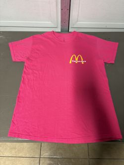 Cactus Jack by Travis Scott x McDonald's Vintage Action Figure II T-Shirt in the hot pink colorway.