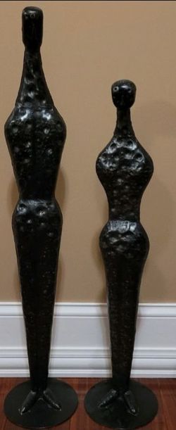 Tall Man& woman statues