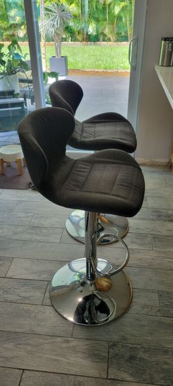 2 gray swivel stools