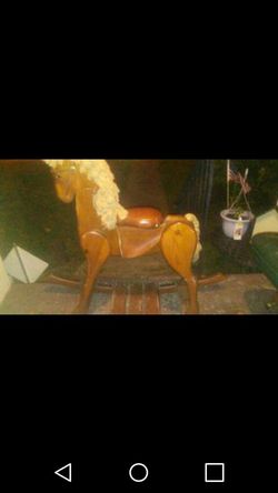 Wood rocking horse decor from the head to the floor its 34 inches and its 42 inches long
