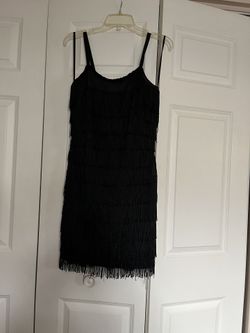 It’s Very Cute Short Cocktail Dress The Size Is Six. The Color Is Black. It’s All Tassel.Dress 