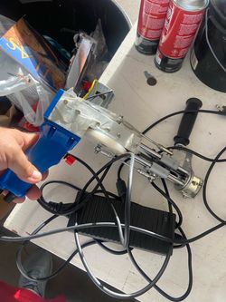 Rug tufting gun with charger