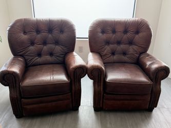 A pair of leather sofas
