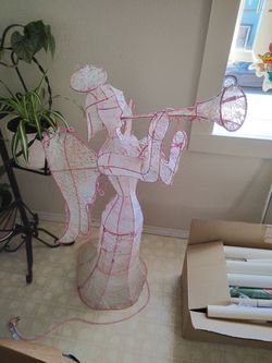 Pink trumpeter angel lights up
