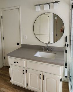 Already removed. Used 49 in vanity and 50 in engineered matte quartz Stone top with undermount porcelain sink and American Standard Faucet