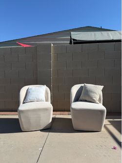 Pair of Ivory Swivel Chairs