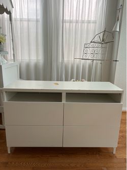 White dresser with soft clothes drawers