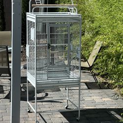 Bird cage with bowls. 24inx22inx65in. Lightly used.