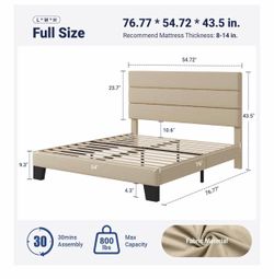 Full-size platform bed frame with an upholstered fabric headboard