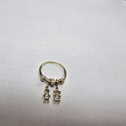 14k LADIES RING WITH BOY/GIRL PENDANT WHITE STONES.