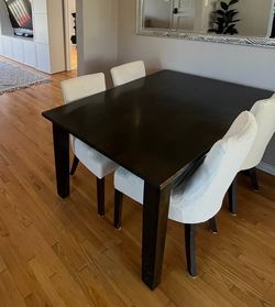 Crate and barrel, dark brown kitchen table, and chairs