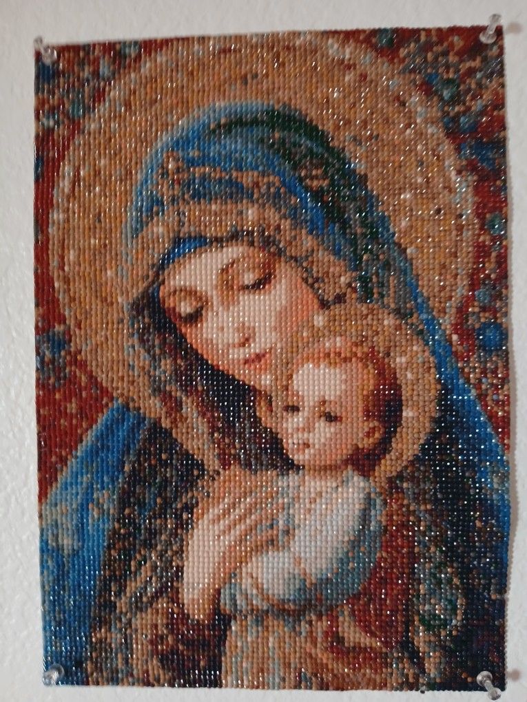 Mother Mary is holding baby Jesus