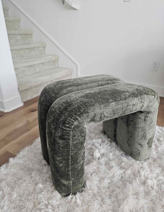 Green upholstered ottoman