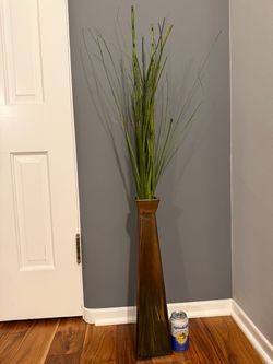 Fake tall decorative plant in vase