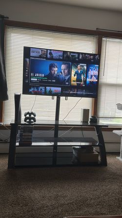 Large Flat Screen 50’ TV with Glass TV Stand