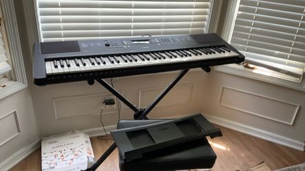Yamaha keyboard PSR-EW310 with stand, seat, charger, and FC4A pedal