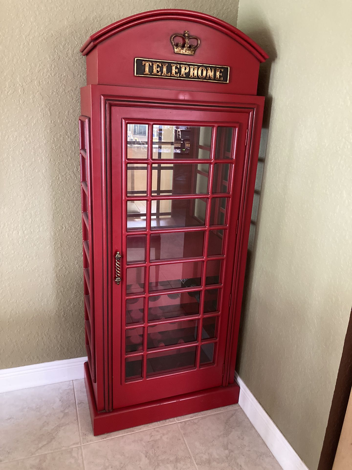 Old English phone booth with wine storage