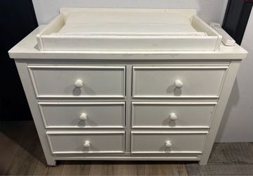 Baby dresser with changing pad