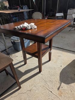 Dark Wood Dining Table with Lower Shelf and 4 chairs