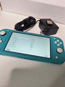 Nintendo Switch Lite Teal barely used with game