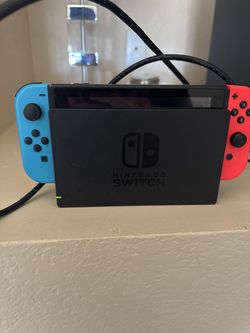 Nintendo Switch (standard model with neon red/blue Joy-Cons