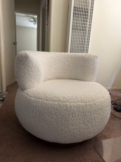 This ivory white boucle 360-degree swivel chair - TWO AVAILABLE