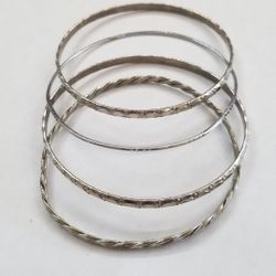 Four Silver Plated Bangle Bracelets 