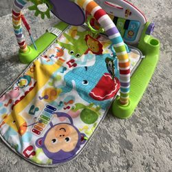 Fisher Price kick n play piano mat