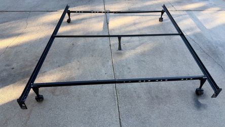 Adjustable  size  Metal Bed Frame with Wheels  $25 pick  up only  bonanza and lamb